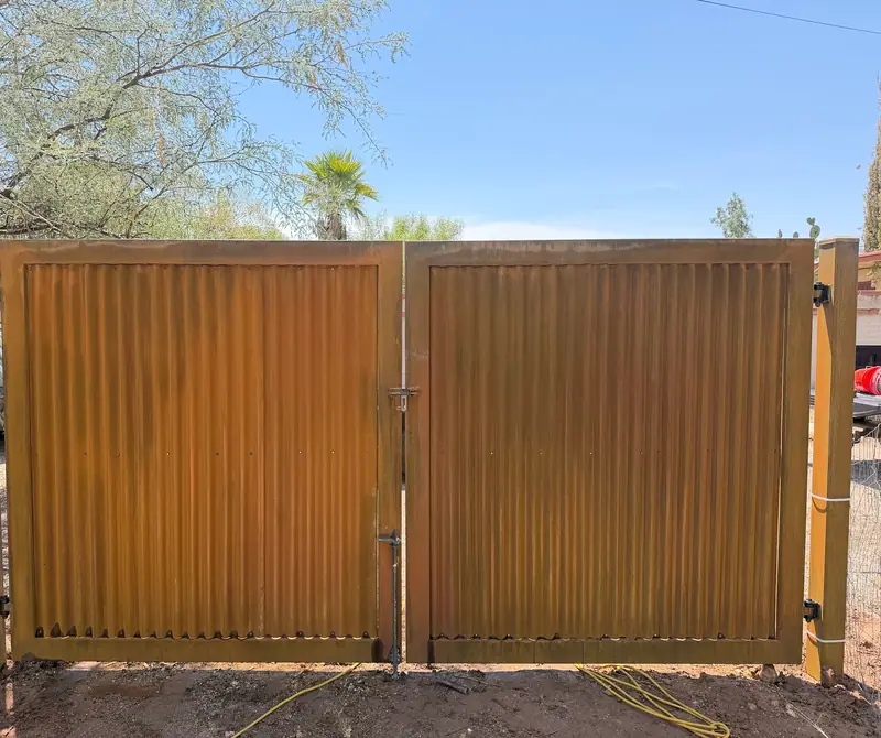 Real job: a double drive gate in rusted corrugated steel