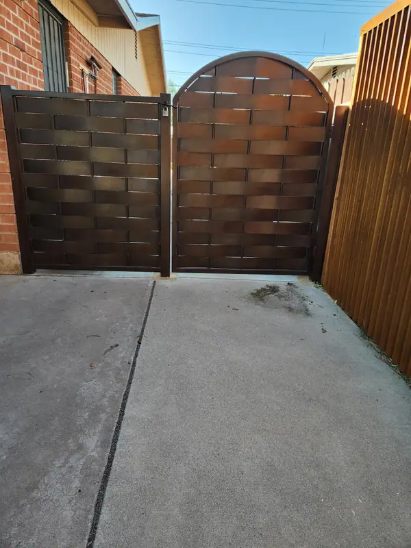 Real job: an arched gate in woven steel strap